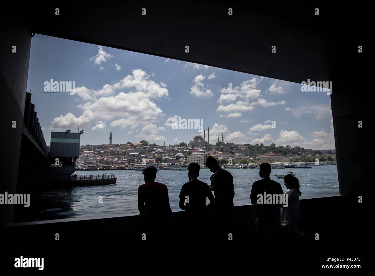 Istanbul, Turkey. 20th June, 2018. Young Turks overlook the Golden Horn from the Galata Bridge in Istanbul, Turkey, 20 June 2018. The country will hold snap elections on June 24th. Credit: Oliver Weiken/dpa/Alamy Live News Stock Photo