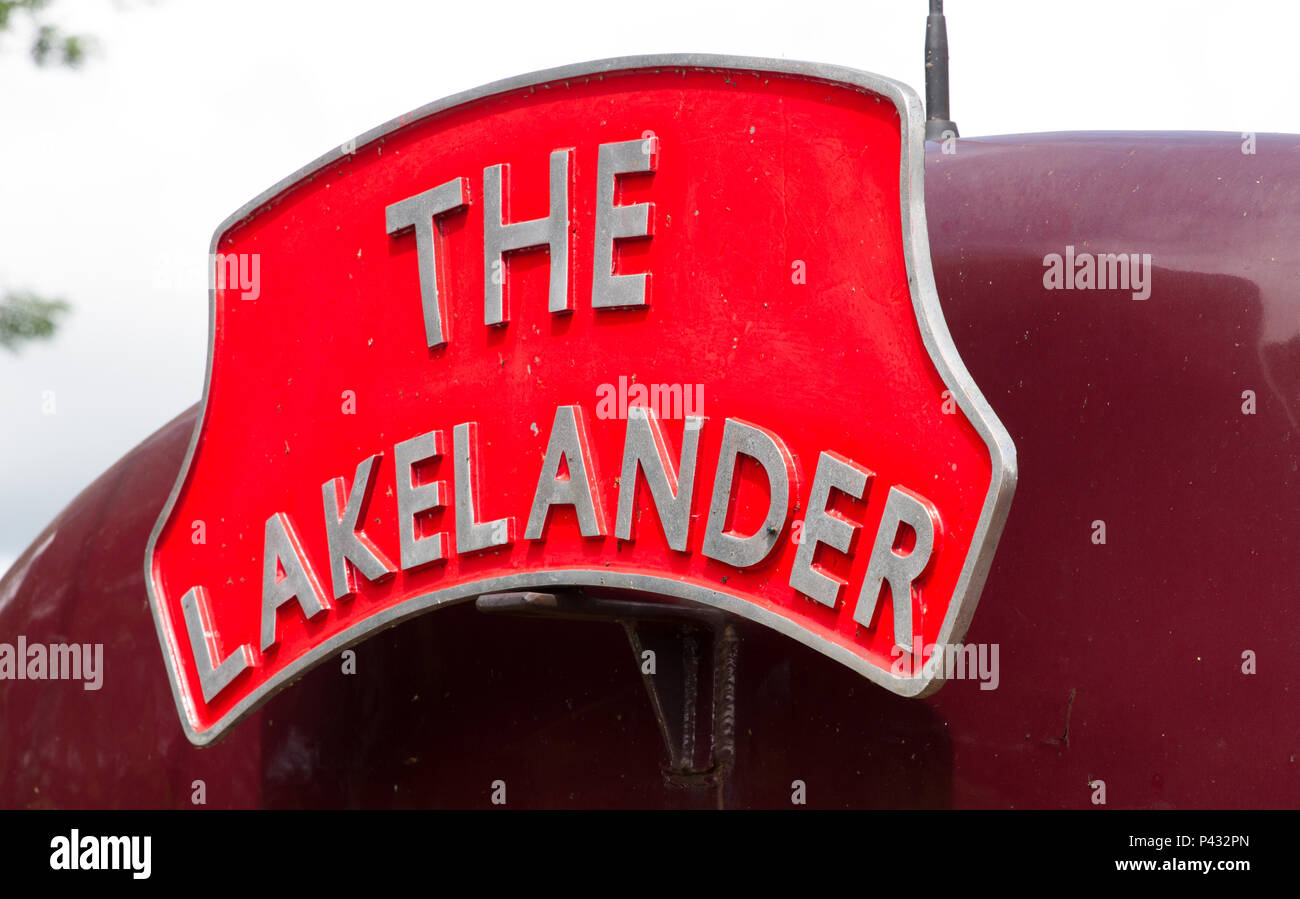 Oxenholme, Lake District, UK. 20th June, 2018. West Coast Railways locomoticve carries a traditional headboard on the Windermere Branch. Charles Allen/Alamy Live News Stock Photo