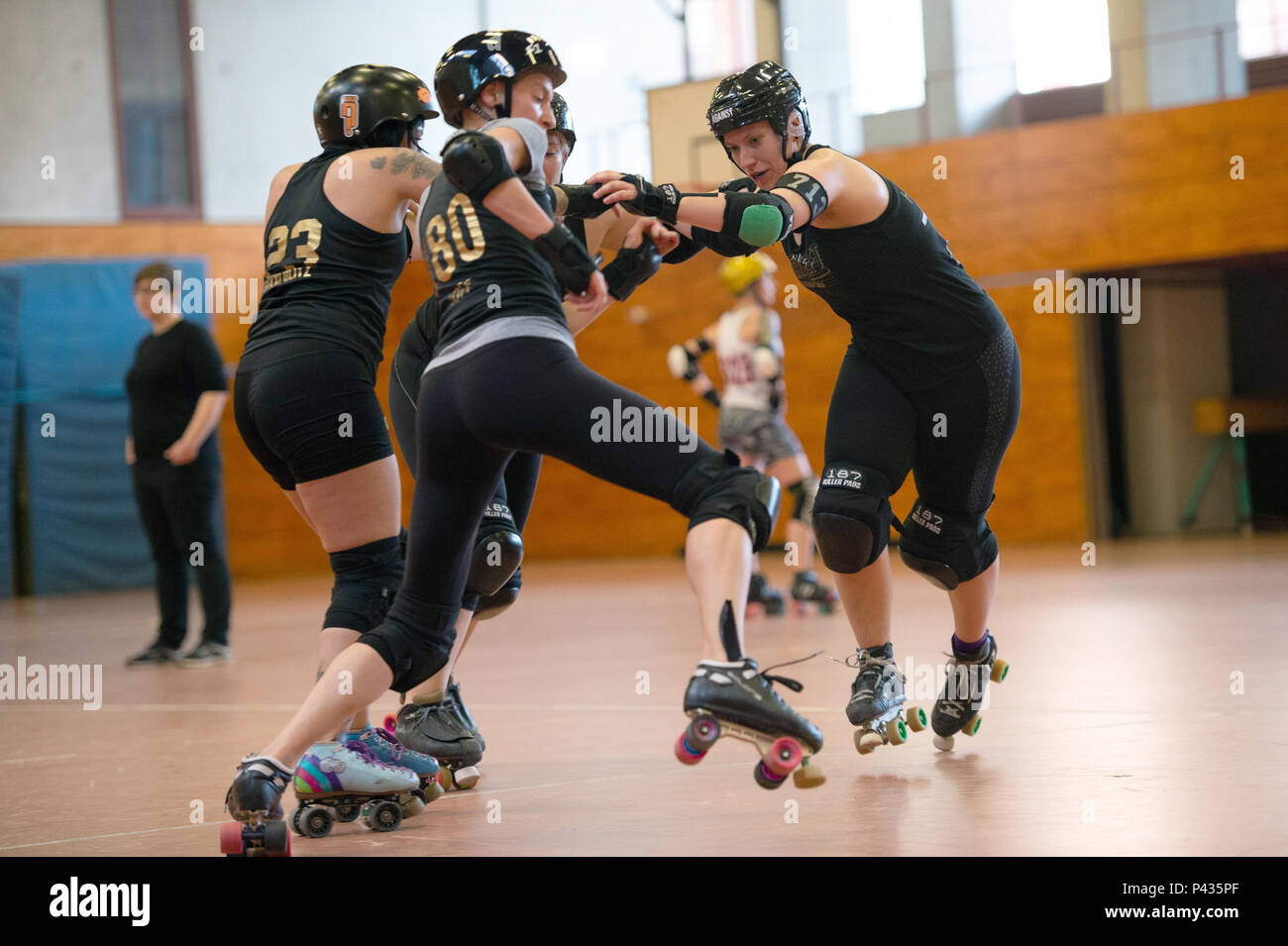 Potsdam, Germany. 24th Apr, 2018. Susanne Eckler (r), sometimes nicknamed  Christie Huckevoll or Hooks, trains with her team, the Bear City Roller  Derby. Roller derby involves full body contact on roller skates