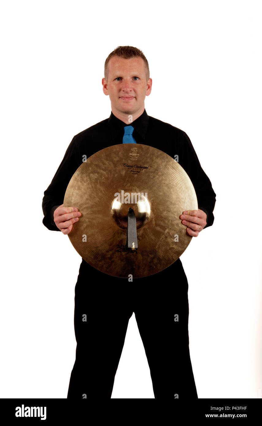 percussionist holding a cymbal Stock Photo - Alamy