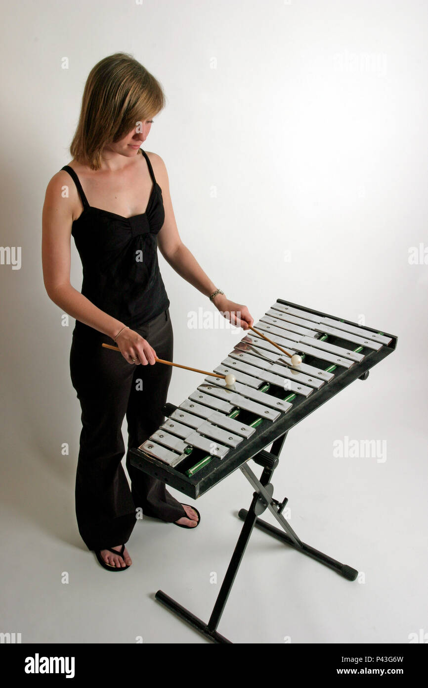 young woman playing the glockenspiel Stock Photo Alamy