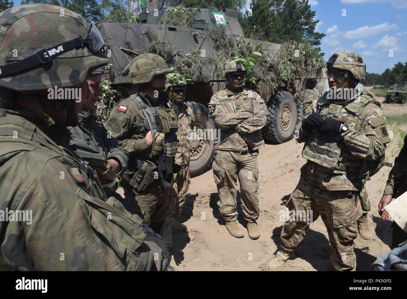 Soldiers from 2nd Battalion, 7th Infantry Regiment engage in situational training exercise with Polish tank platoons as part of Ankakonda 16 at Drawsko Pomorskie, Poland June 8, 2016. Stock Photo