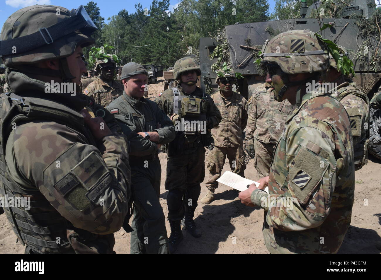 Soldiers from 2nd Battalion, 7th Infantry Regiment prepare for a situational training exercise with the Polish tank platoon as the opposing force as part of Anakonda 16 at Drawsko Pomorskie, Poland June 8, 2016. Stock Photo