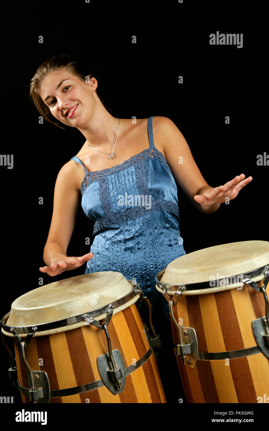 Young woman playing the congas Stock Photo Alamy