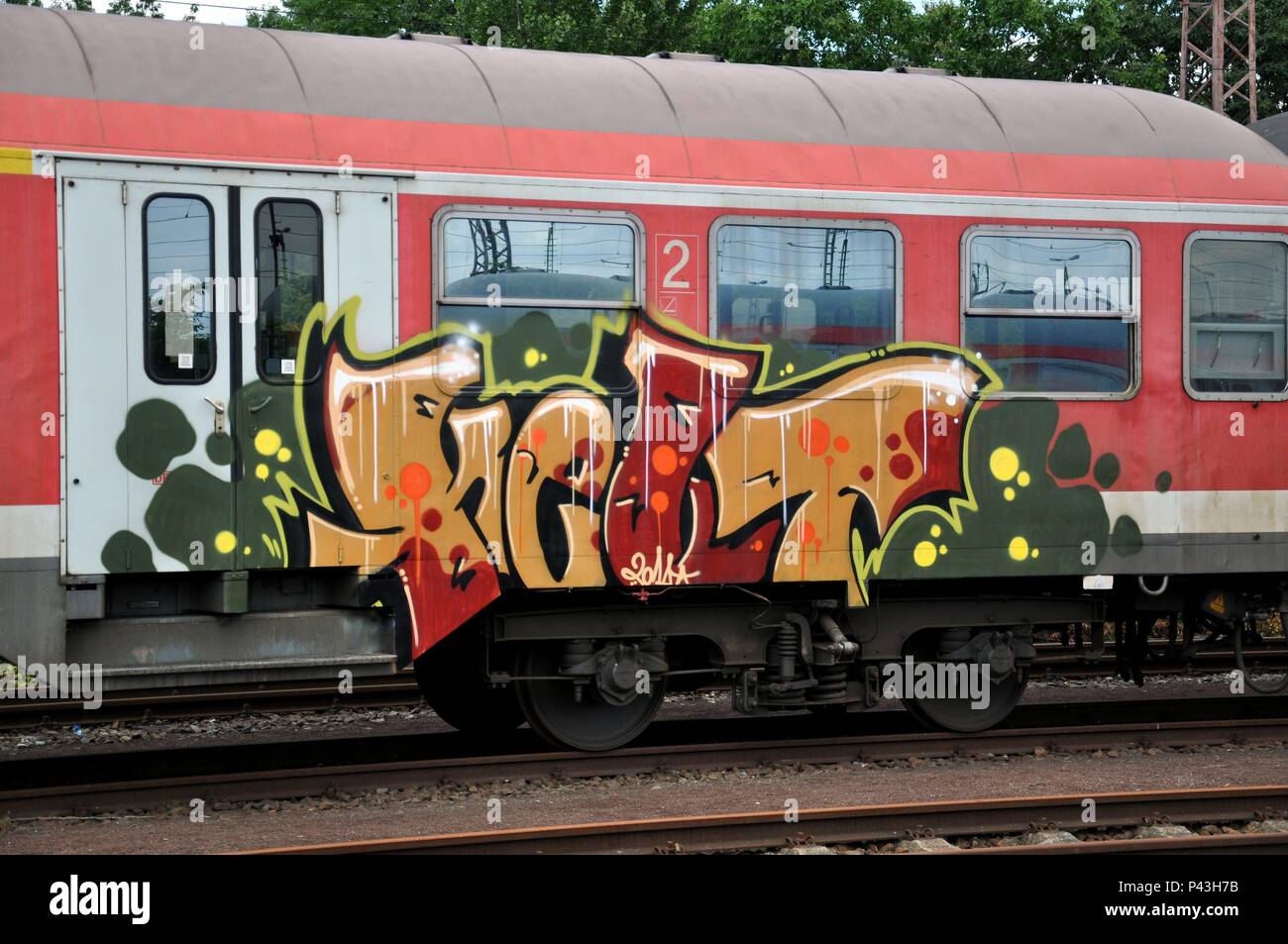Graffiti on passenger train on 22.07.2012 in Hamm - Germany. | usage worldwide Stock Photo