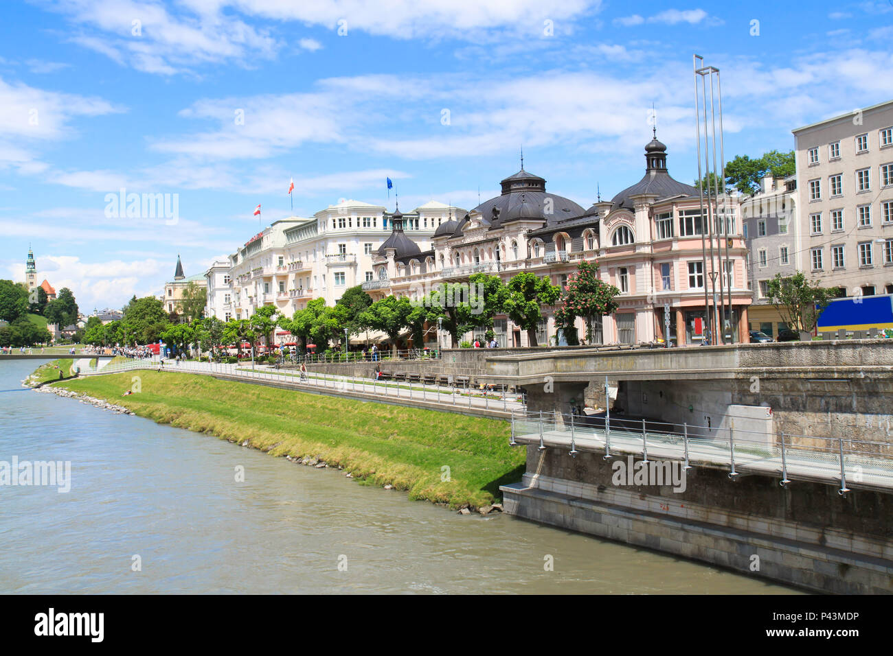 Elegant buildings line the Salzach River, downtown Salzburg, Austria ...
