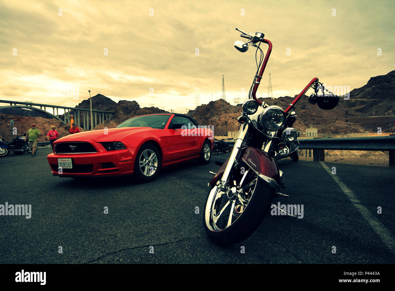 Motorcycle and car side by side showing their muscle...ready to hit the road Stock Photo