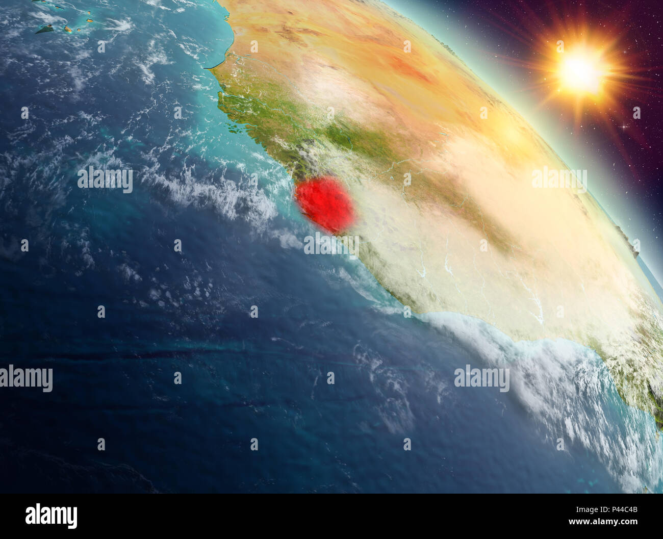 Sunrise above Sierra Leone highlighted in red on model of planet Earth ...