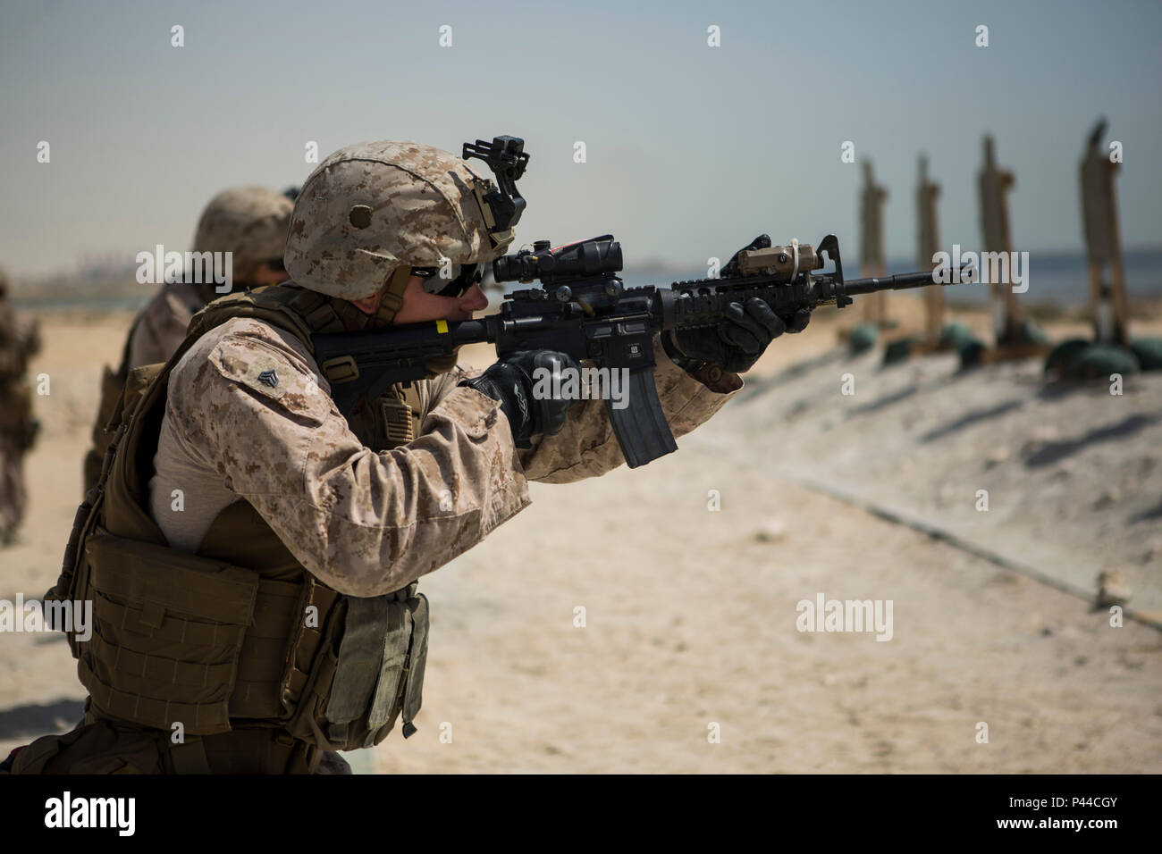 U.S. Marine Corps Sgt. Vincent Shafer, 3rd Platoon Guide with Company C, Marine Wing Support Squadron 373, Special Purpose Marine Air Ground Task Force - Crisis Response - Central Command, fires an M4 carbine during a combat marksmanship practice range, June 5, 2016. SPMAGTF-CR-CC is forward deployed in several host nations, with the ability to respond to a variety of contingencies rapidly and effectively. (U.S. Marine Corps photo by Sgt. Donald Holbert/ Released) Stock Photo