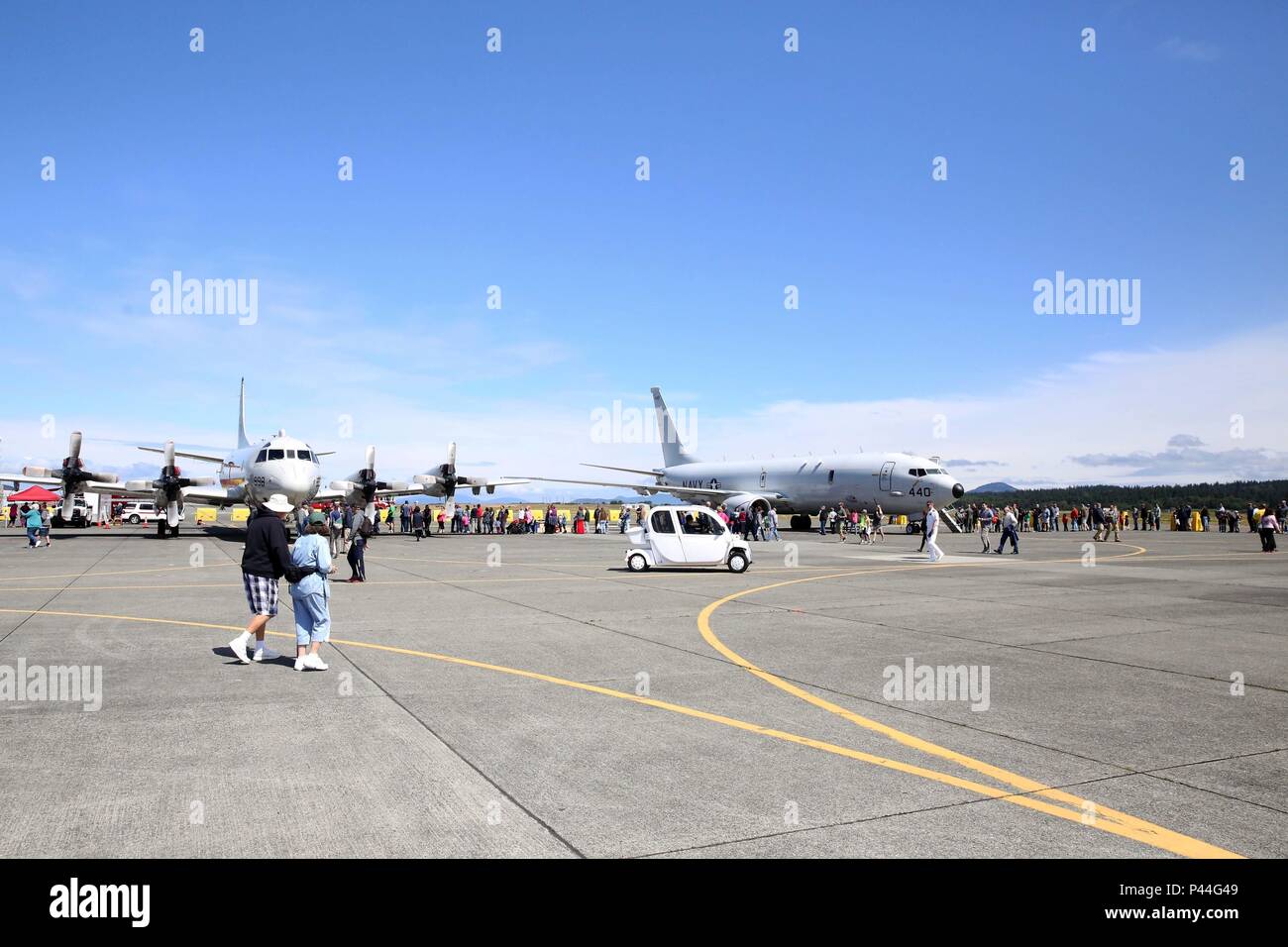 160625-N-DC740-037 OAK HARBOR, Wash. (June 25, 2016)  Guests line up to tour a P-3 Orion, left, and a P-8 Poseidon during Naval Air Station Whidbey Island's (NASWI) open house. The open house provides the general public an opportunity to interact with Sailors and learn more about NASWI's role both in the community and the Navy. (U.S. Navy photo by Mass Communication Specialist 2nd Class John Hetherington/Released) Stock Photo