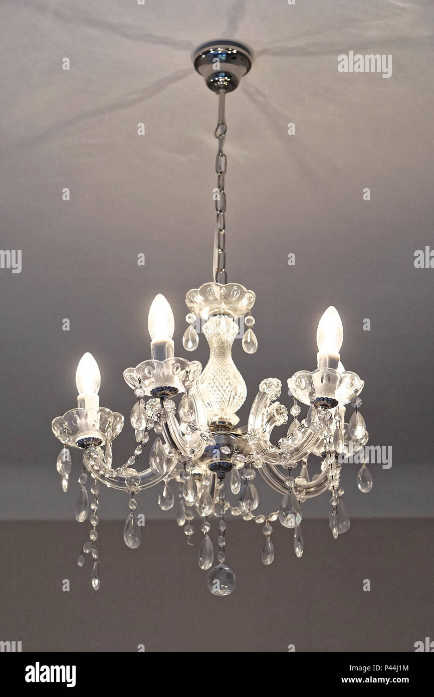 Crystal chandelier with incandescent light bulbs Stock Photo Alamy