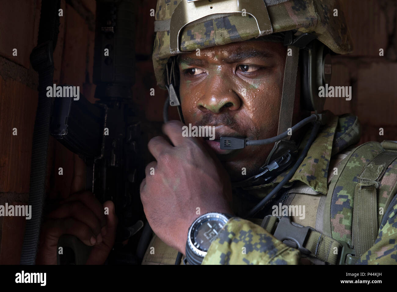 A Canadian soldier communicates on his radio during a Military Operations  in Urban Terrain in Wedzryn, Poland July 14, 2016, which was part of  exercise Anakonda 2016. The exercise is a Polish-led,