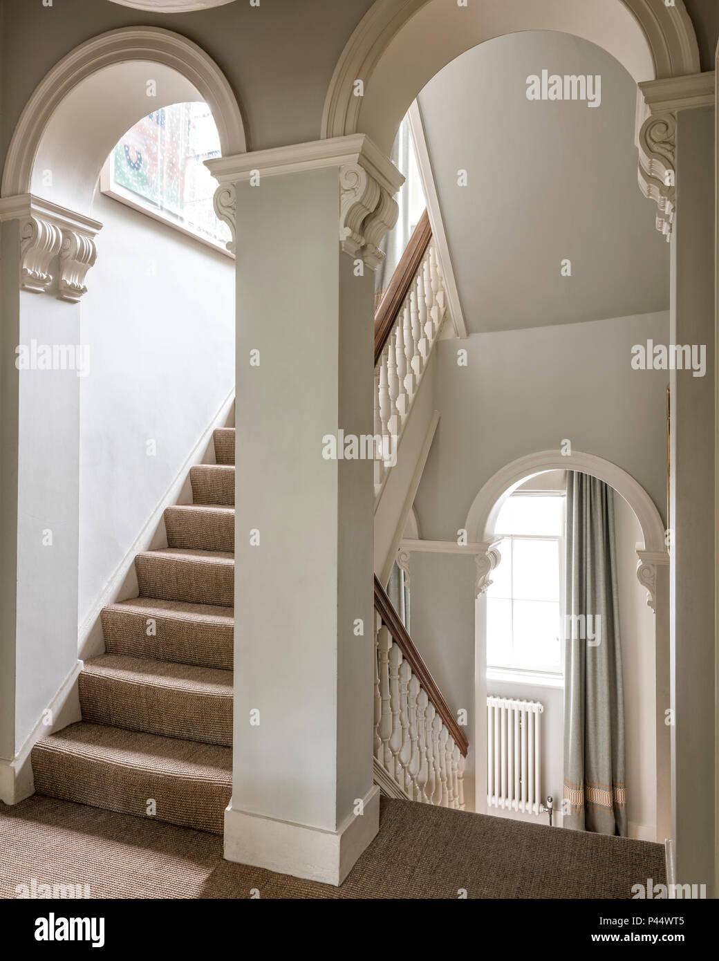 Elegant Victorian arches in stairway Stock Photo - Alamy