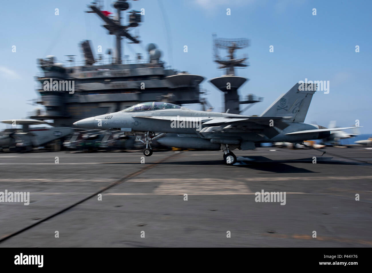 160626-N-DZ642-104 MEDITERRANEAN SEA (June 26, 2016) An F/A-18F Super Hornet, assigned to the “Jolly Rogers” of Strike Fighter Squadron (VFA) 103, lands on the flight deck of aircraft carrier USS Harry S. Truman (CVN 75). Harry S. Truman Carrier Strike Group is deployed in support of maritime security operations and theater security cooperation efforts in the U.S. 6th Fleet area of operations. (U.S. Navy photo by Mass Communication Specialist 3rd Class Bobby J Siens/Released) Stock Photo