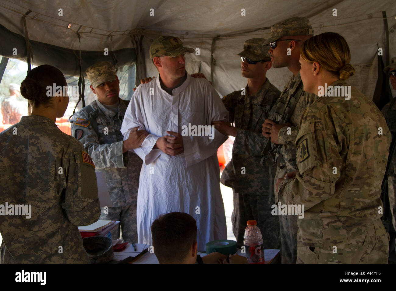 U.s. Army Reserve (Usar) Soldiers With The 812Th Military Police Company  From Orangeburg, New York In-Process A Role Player Before Taking Him To A  Holding Cell As Part Of An Exercise In