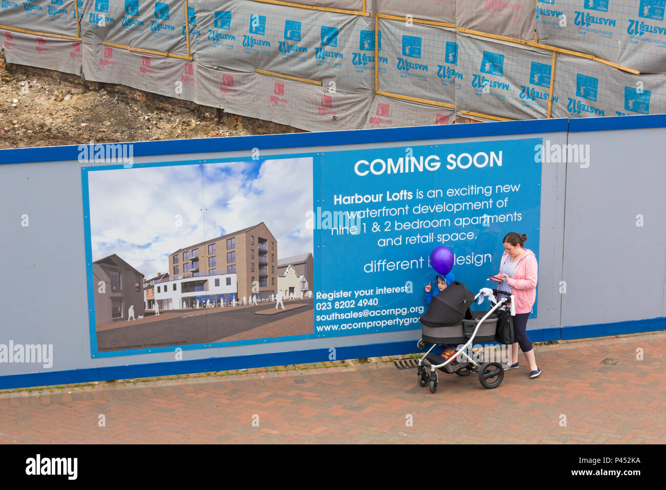 Coming soon housing development sign at Poole Quay, Dorset UK in June Stock Photo