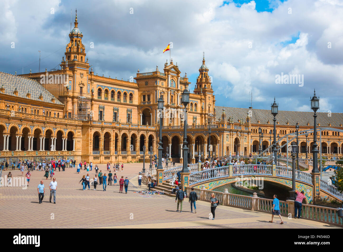 Plaza de Espana Seville, view of people walking through the historic Plaza de Espana in Seville (Sevilla) on a summer afternoon, Andalucia, Spain. Stock Photo