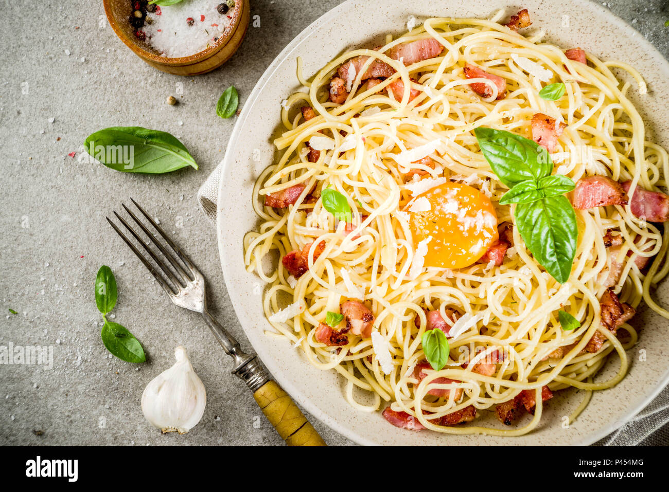 Traditional Italian Pasta Spaghetti Carbonara With Bacon Creamy Sauce Parmesan Cheese Egg Yolk And Fresh Basil Leaves Grey Stone Background Copy S Stock Photo Alamy
