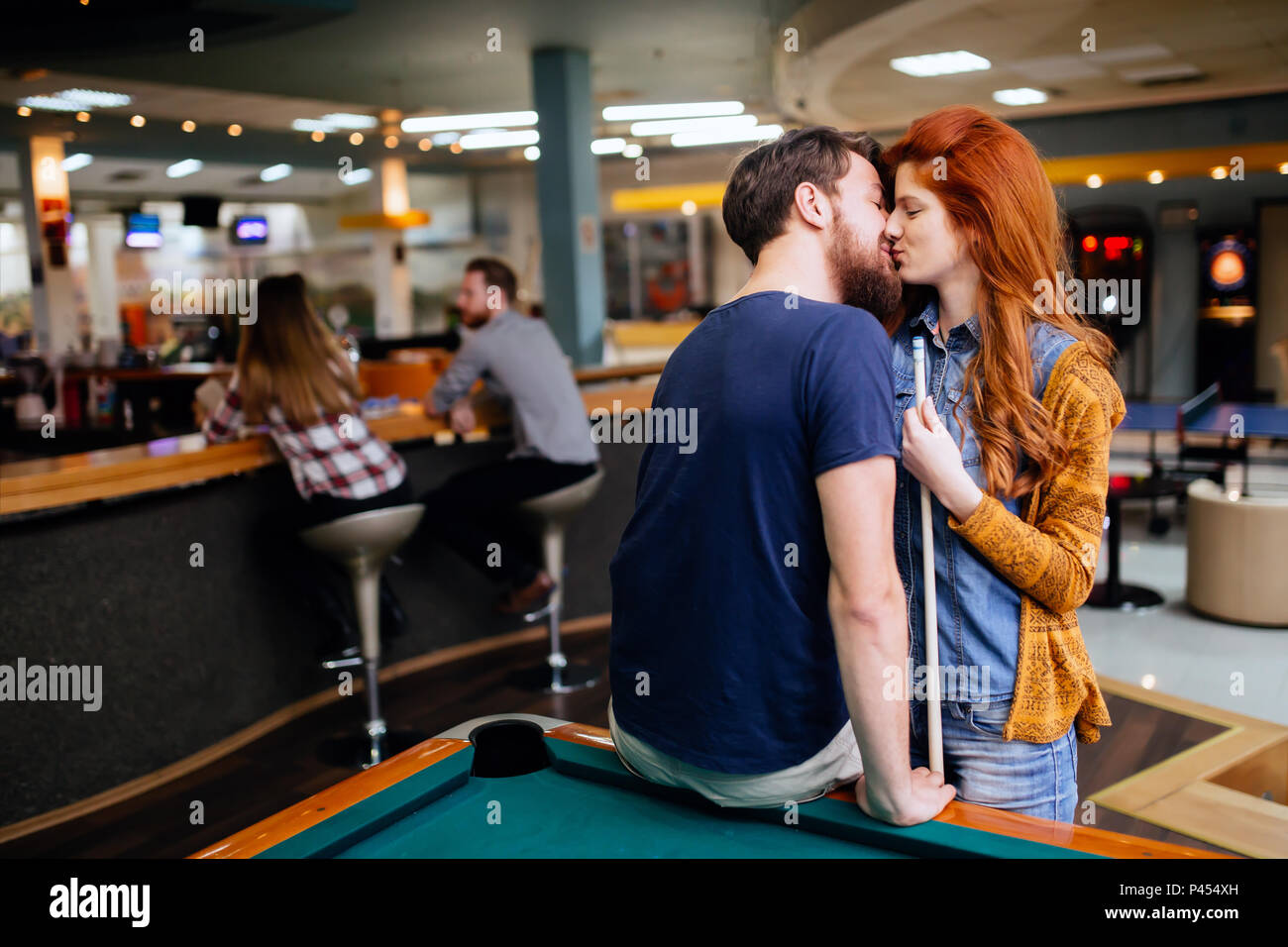 Couple kissing on a date Stock Photo