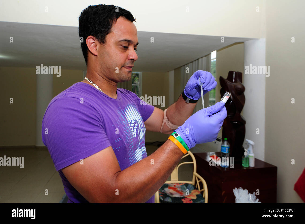 Alain Pujolar, U.S. Air Force School of Aerospace Medicine epidemiologist prepares blood samples for shipping, June 7, in Rio San Juan, Dominican Republic.  Pujalar is part of a five-man, field epidemiology team who arrived in the Dominican Republic conduct a public health investigation of the Zika virus disease among Exercise NEW HORIZONS personnel.  (U.S. Air Force photo by Master Sgt. Chenzira Mallory/released) Stock Photo