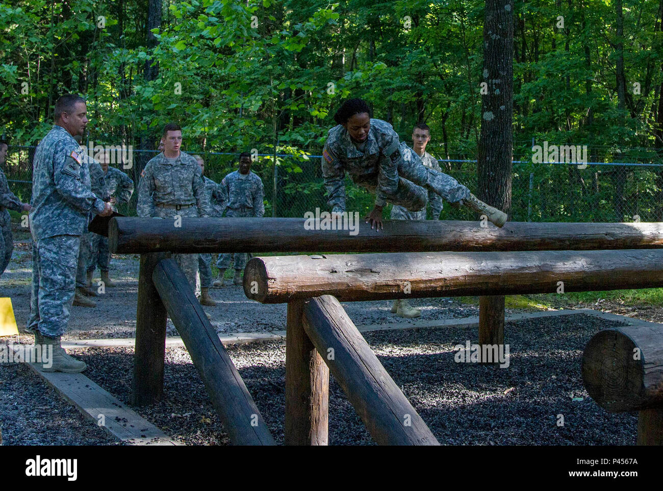 An Army Reserve instructor, attached to Task Force Wolf, monitors a ...