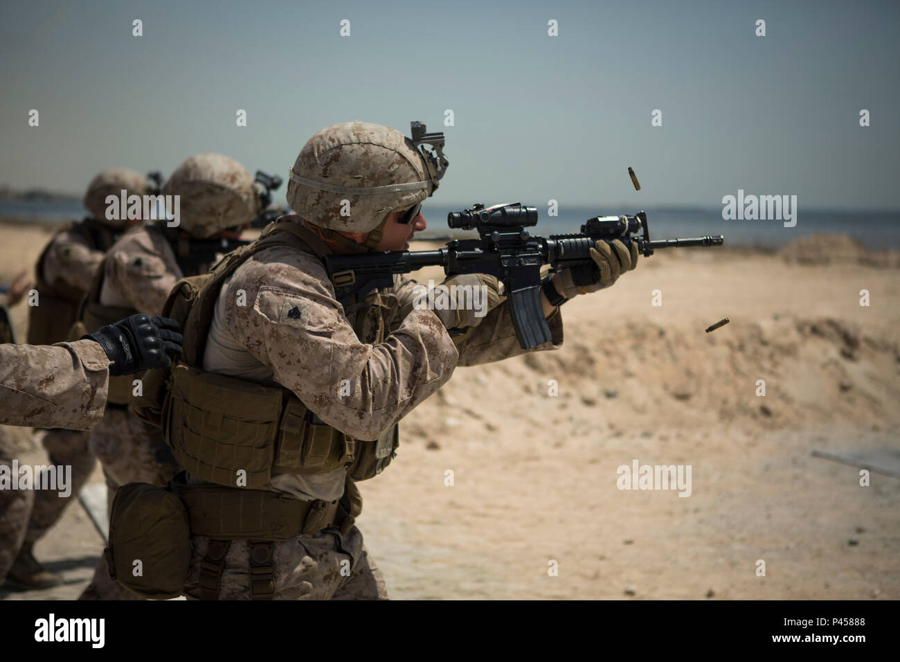U.S. Marine Corps Sgt. Zachary Runge, squad leader with Company C, Marine Wing Support Squadron 373, Special Purpose Marine Air Ground Task Force - Crisis Response - Central Command, conducts a forward assault during a combat marksmanship practice range, June 5, 2016. SPMAGTF-CR-CC is forward deployed in several host nations, with the ability to respond to a variety of contingencies rapidly and effectively. (U.S. Marine Corps photo by Sgt. Donald Holbert/ Released) Stock Photo