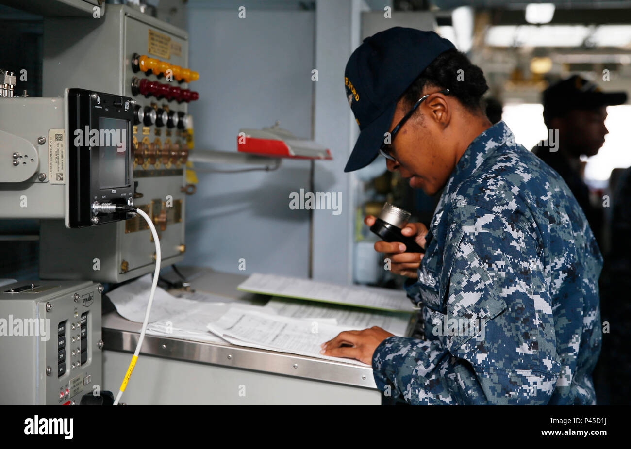 NEWPORT NEWS, Va. (June 7, 2016) --  Boatswain's Mate 2nd Class Shavanda Stephens, assigned to Pre-Commissioning Unit Gerald R. Ford (CVN 78), announces the setting of material condition modified zebra over the 1MC in the ship's bridge. Ford is the first of its class and is currently under construction at Huntington Hall Ingalls Newport News Shipbuilding. (U.S. Navy photo by Mass Communication Specialist Seaman Cathrine Mae O. Campbell/Released) Stock Photo