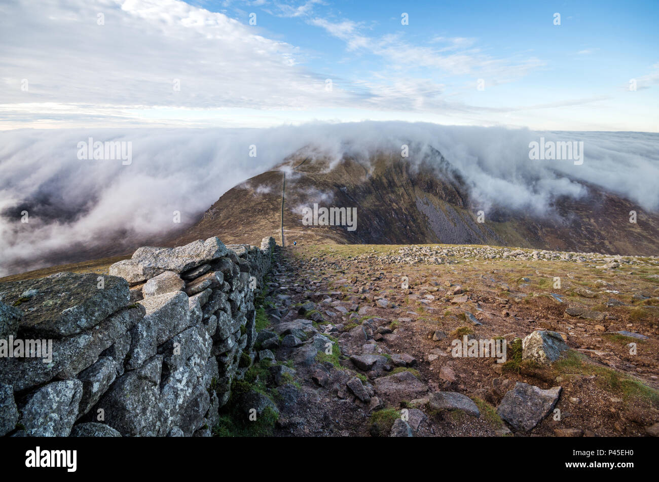 A view along Slieve Donard wall to low lying clouds. Stock Photo