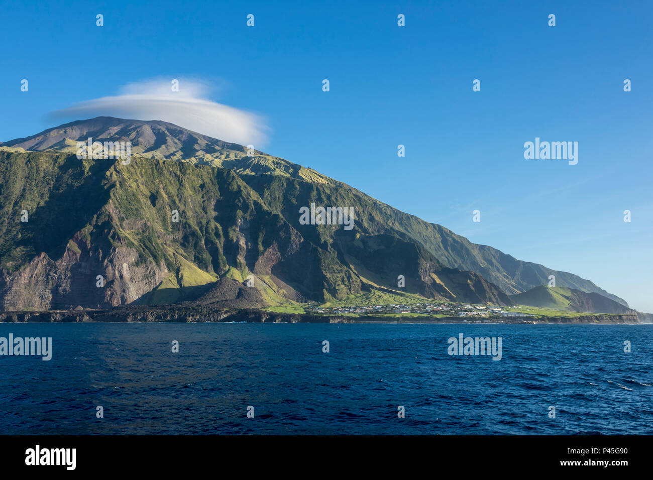 The settlement of Edinburgh of the Seven Seas, Tristan da Cunha, with the peak of the volcano
