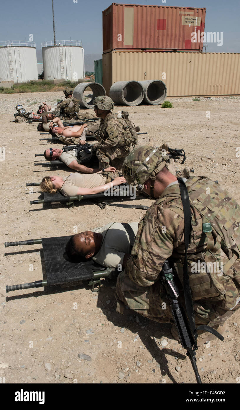 The 83rd Expeditionary Rescue Squadron pararescue specialists along with soldiers from Task Force Chosen work together to treat wounded patients during a joint mass casualty and extraction exercise, June 16, 2016 at Bagram Airfield, Afghanistan. Airmen from the 455th AEW acted as wounded patients, with injuries that included broken limbs, loss of eye sight and deliria. (U.S. Air Force photo by Tech. Sgt. Tyrona Lawson) Stock Photo