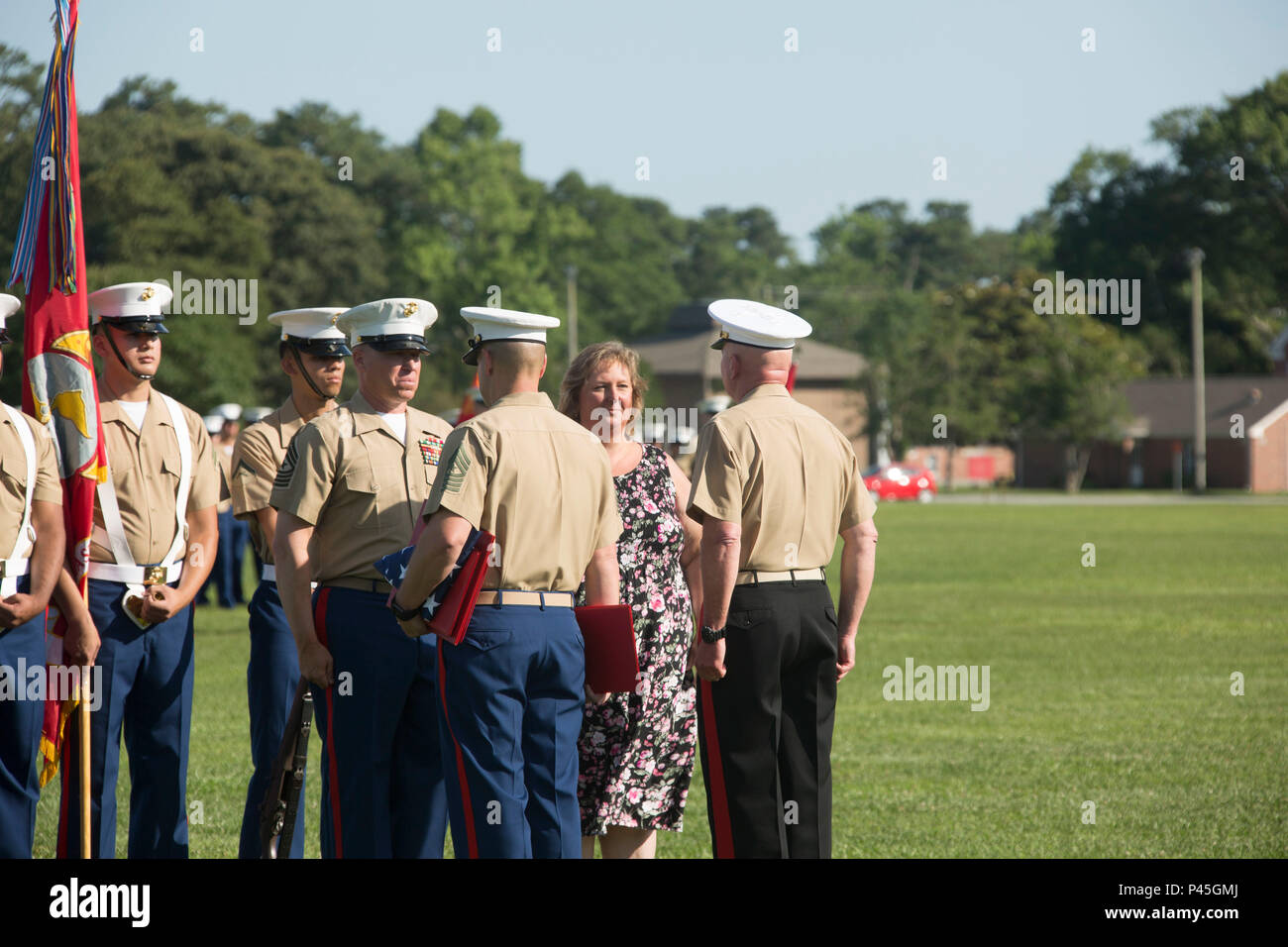 U.S. Marine Corps Maj. Gen. Walter L. Miller Jr. (right), commanding general, II Marine Expeditionary Force, presents Sgt. Maj. Paul A. Berry (left), off going sergeant major, Marine Corps Installations East (MCIEAST), Marine Corps Base Camp Lejeune (MCB CAMLEJ), with awards during a retirement ceremony for MCIEAST, MCB CAMLEJ, on William Pendleton Thompson Hill Field, Camp Lejeune, June 9, 2016. Berry retired after 30 years of honorable and faithful service. (U.S. Marine Corps photo by Lance Cpl. Careaf L. Henson, MCIEAST Combat Camera/Released) Stock Photo