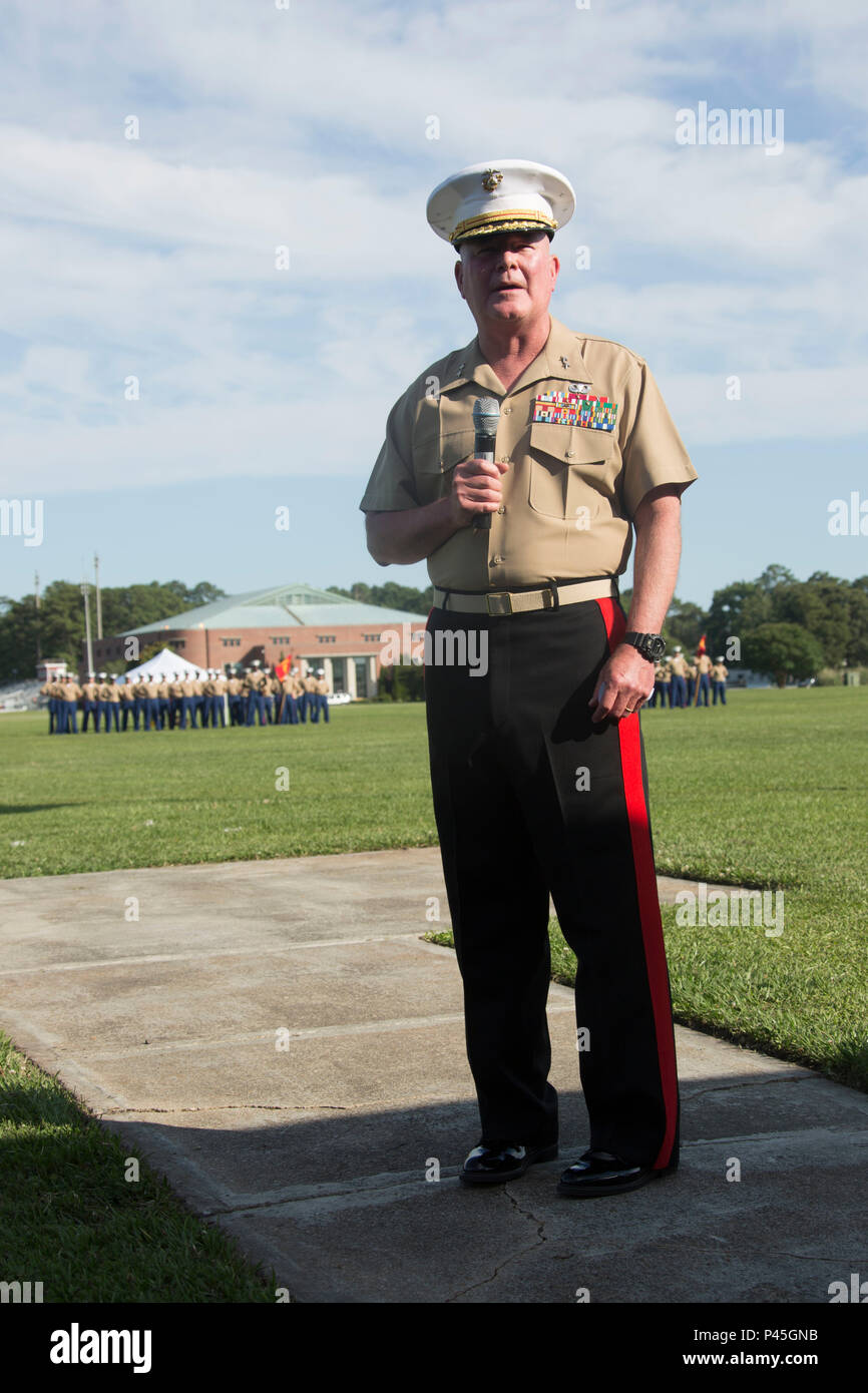 U.S. Marine Corps Maj. Gen. Walter L. Miller Jr. (right), commanding general, II Marine Expeditionary Force, gives his remarks during a retirement ceremony for Marine Corps Installations East, Marine Corps Base Camp Lejeune, on William Pendleton Thompson Hill Field, Camp Lejeune, June 9, 2016. Berry retired after 30 years of honorable and faithful service. (U.S. Marine Corps photo by Lance Cpl. Careaf L. Henson, MCIEAST Combat Camera/Released) Stock Photo