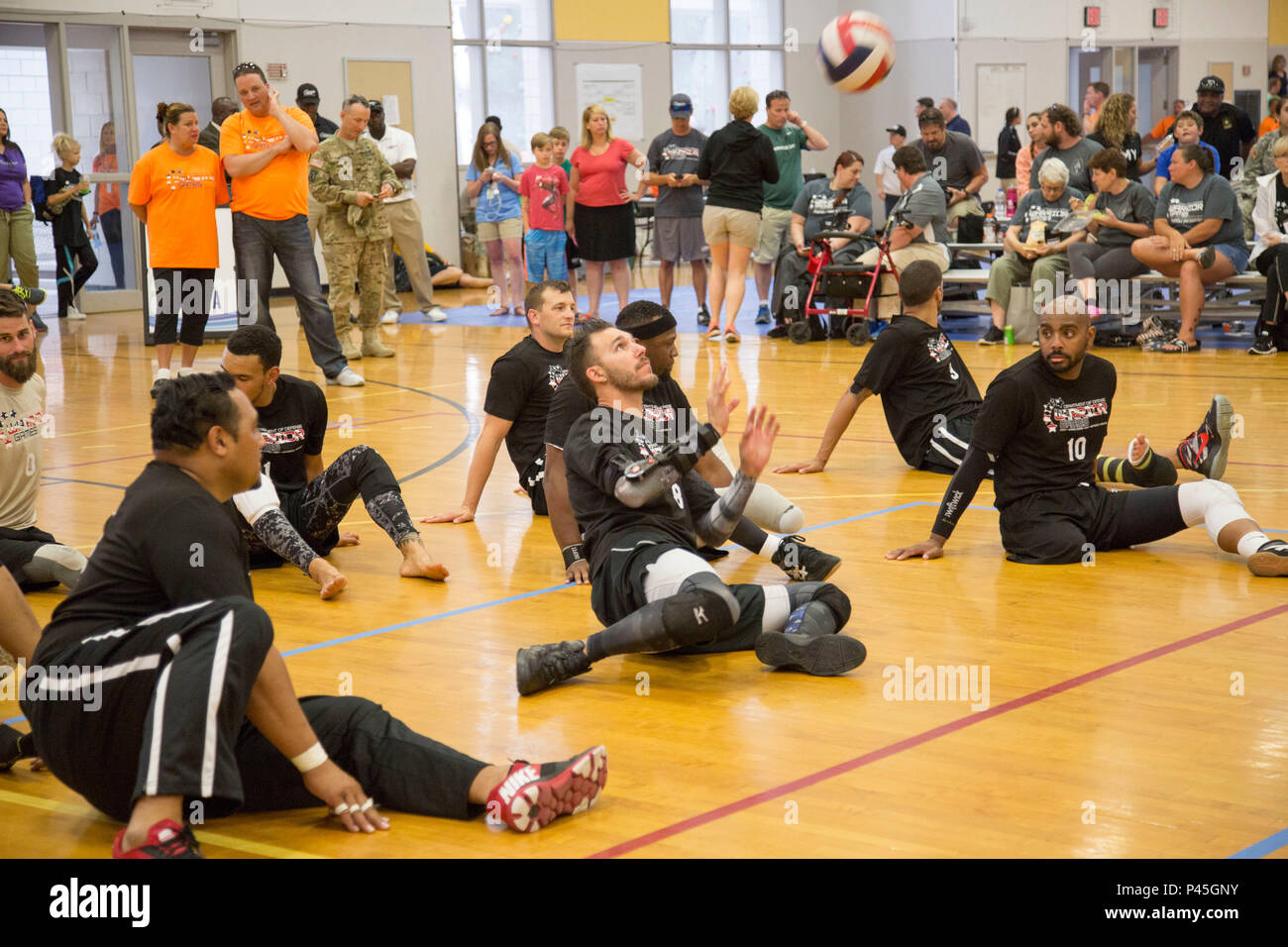 U.S. Army Veteran Sgt. Robbie Guapp, of Gatesville, Texas, bumps the volleyball during the 2016