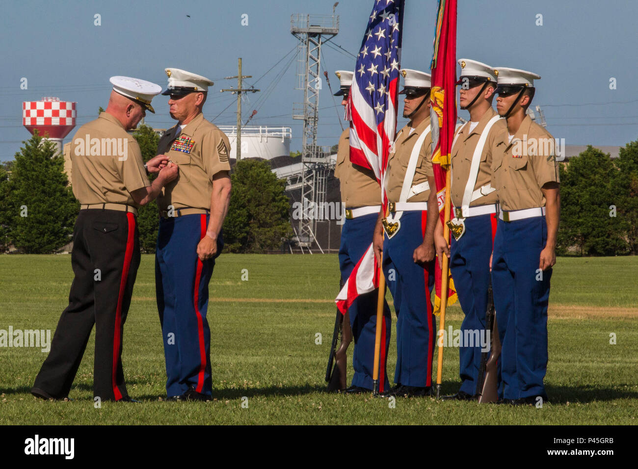U.S. Marine Corps Maj. Gen. Walter L. Miller Jr. (left), commanding general, II Marine Expeditionary Force, presents Sgt. Maj. Paul A. Berry, with a Legion of Merit Medal during his retirement ceremony, William Pendleton Thomas Hill Field, June 9, 2016. Berry retired after 30 years of honorable and faithful service. (U.S. Marine Corps photo by Lance Cpl. Judith L. Harter, MCIEAST Combat Camera/Released) Stock Photo