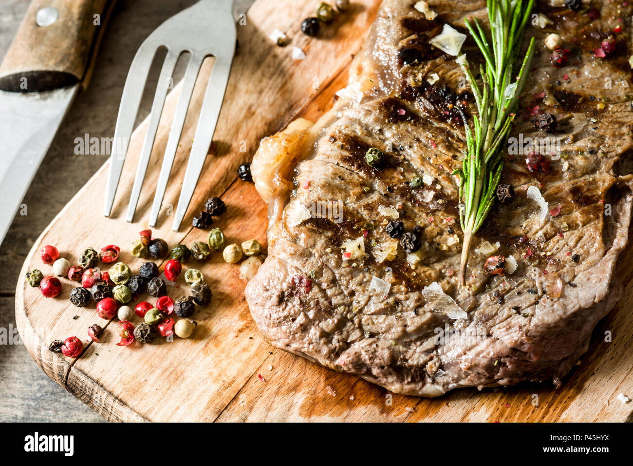 Grilled beef steak and spicy on rustic wooden background Stock Photo ...