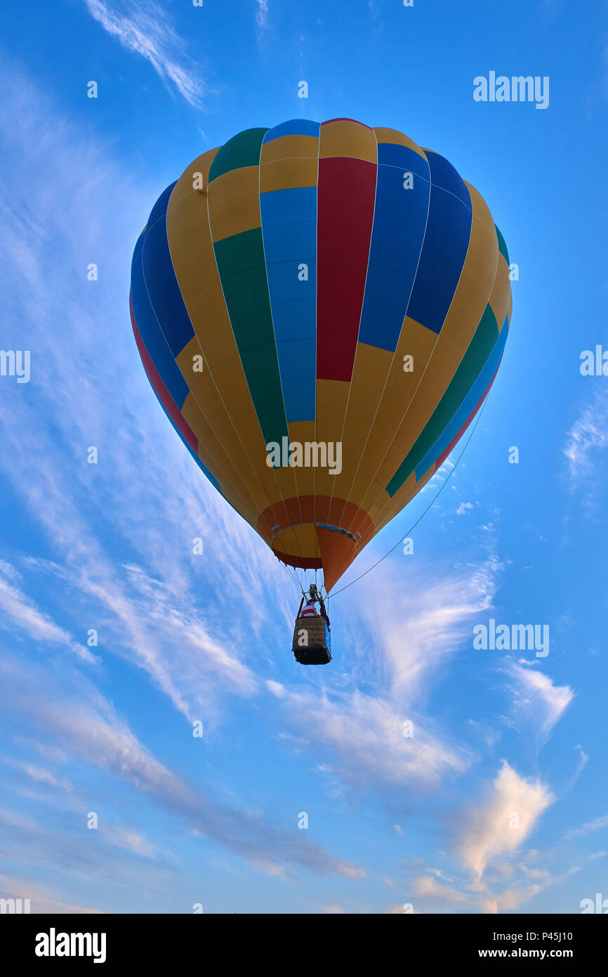 Colorful hot air balloon fly in the blue cloudy sky Stock Photo - Alamy
