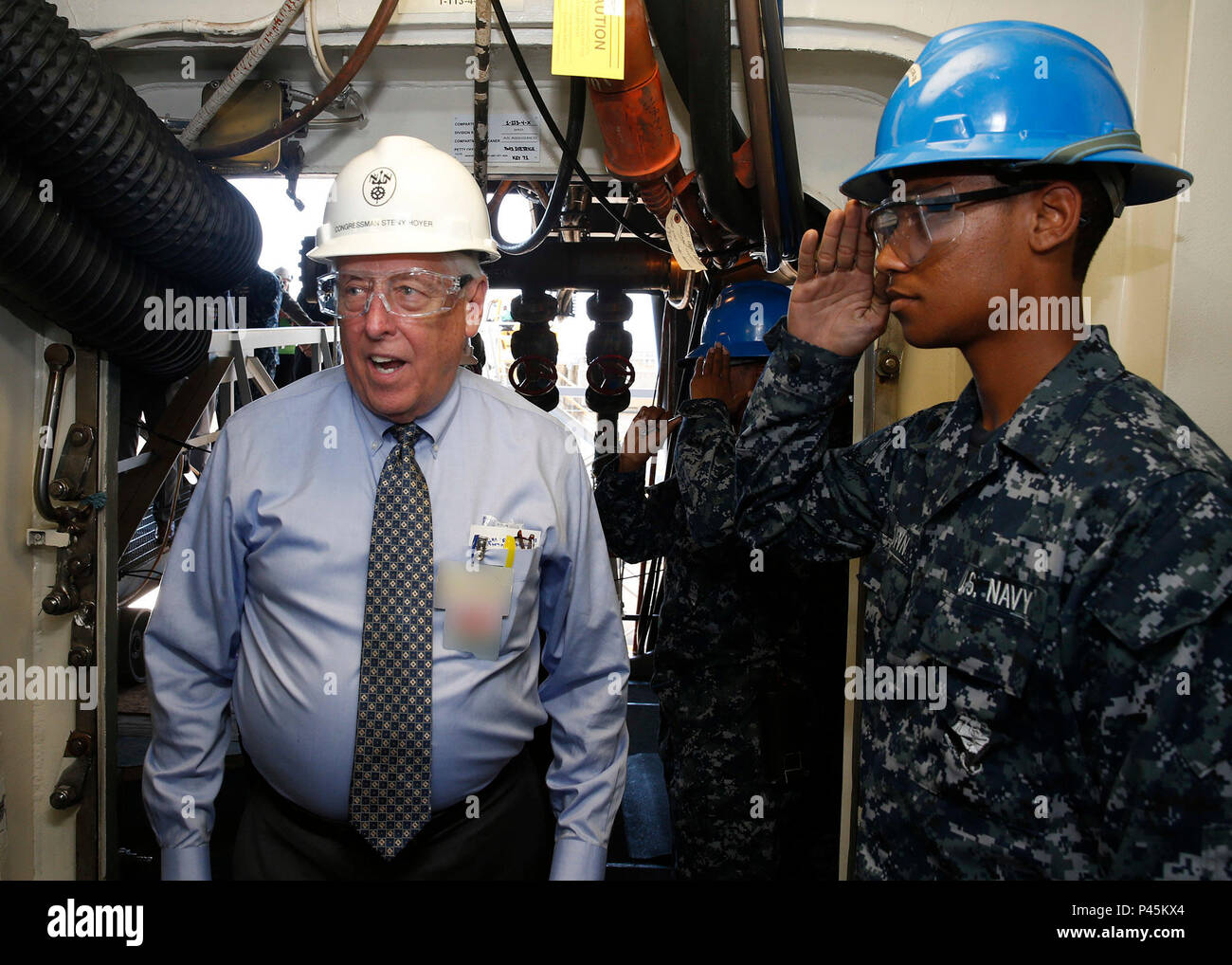 NEWPORT NEWS, VA. (June 20, 2016) Representative Steny Hoyer, Maryland's 5th Congressional District, visits Pre-Commissioning Unit Gerald R. Ford (CVN 78), to see the technological advances aboard the ship. Ford is the first of its class and under construction at Huntington Ingalls Industries Newport News Shipbuilding. (U.S. Navy photo by Mass Communication Specialist 3rd Class Matthew R. Fairchild/Released) (This image was altered for security purpose by blurring out security badges) Stock Photo