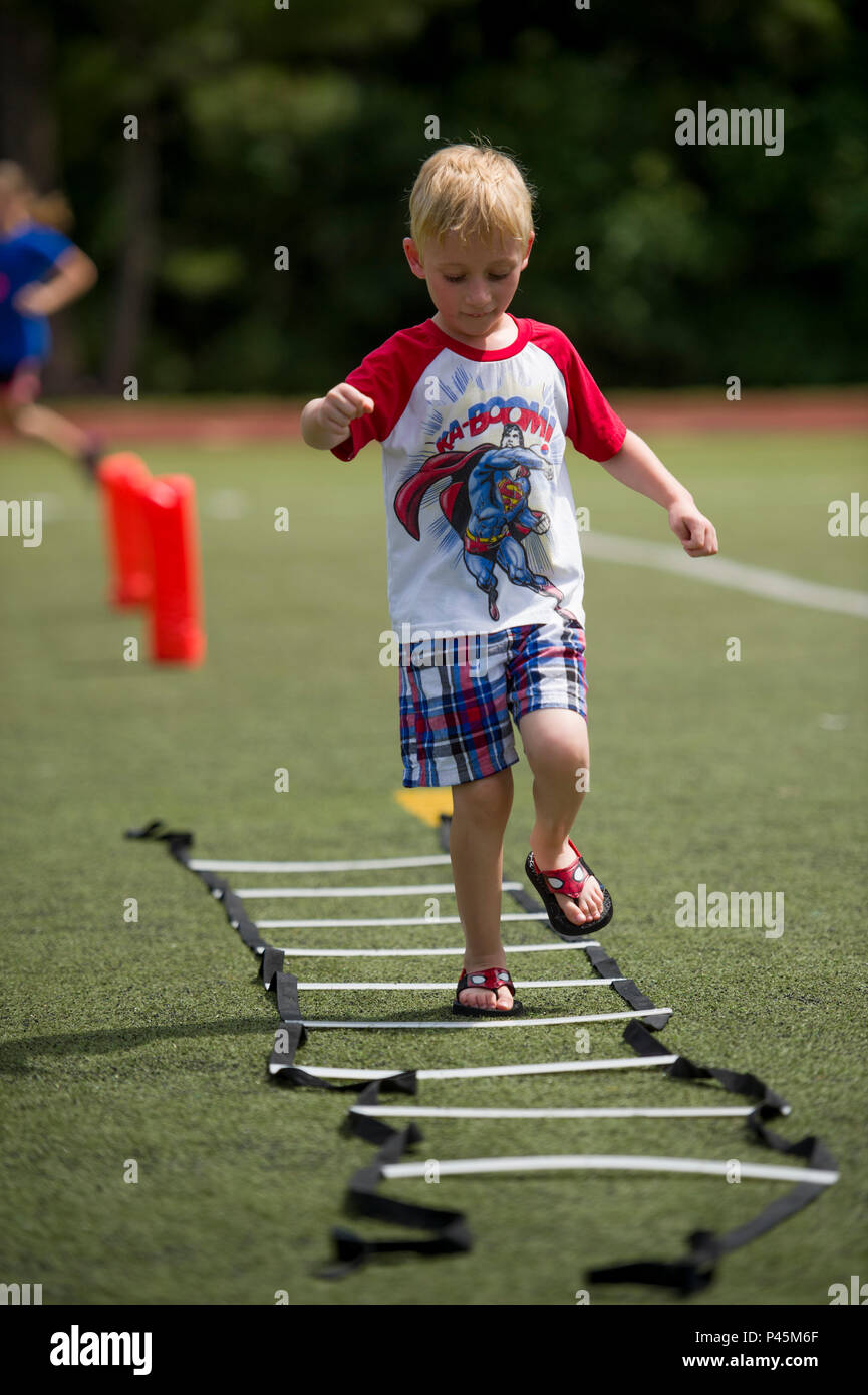 A child runs through a training circuit during the library’s Summer