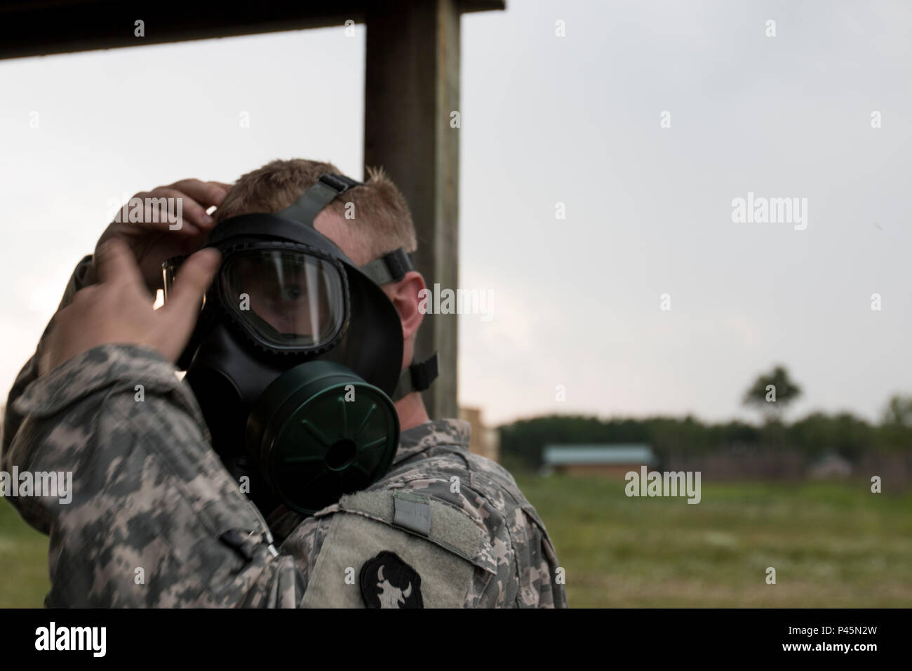 A Soldier with Headquarters Support Company, 834th Aviation Support Battalion prepares to go into the gas chamber for a nuclear, biological, and chemical training exercise at Camp Ripley, Minn., on June 17, 2016. CS gas is used for the training and is a tear gas. (Minnesota National Guard photo by Sgt. Sebastian Nemec, 34th Combat Aviation Brigade Public Affairs NCO) Stock Photo