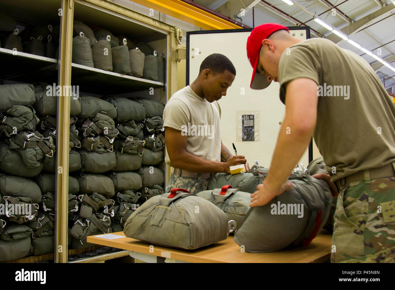 Parachute riggers with the 11th Quartermaster Company, the 82nd ...
