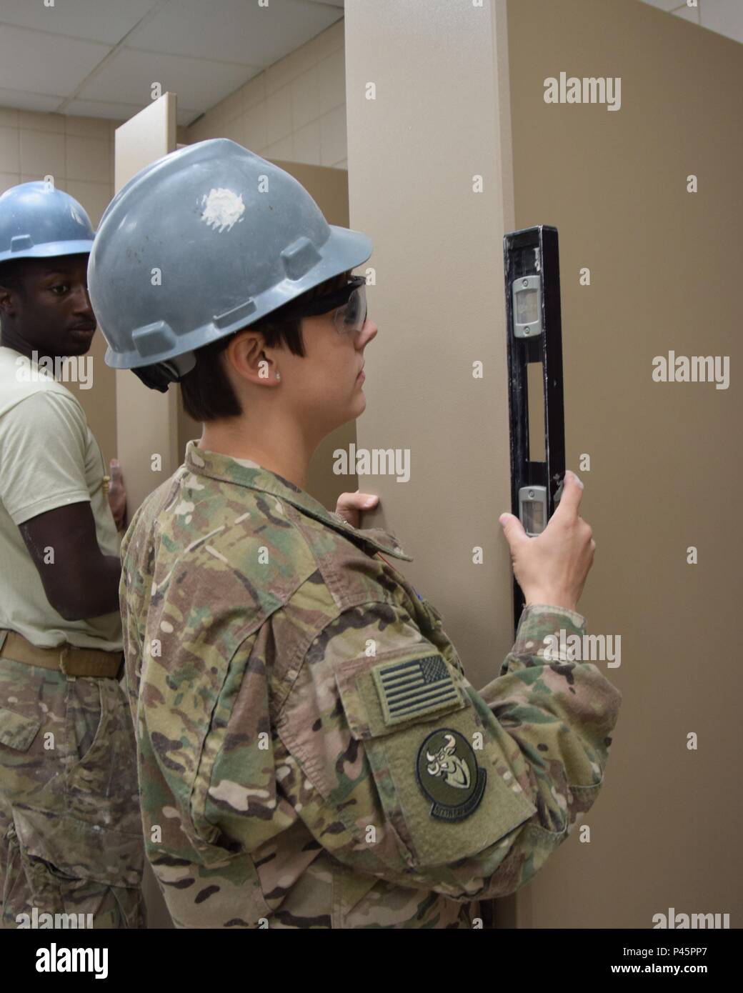 Senior Airman Keonte Lewis watches as Senior Airman Candice