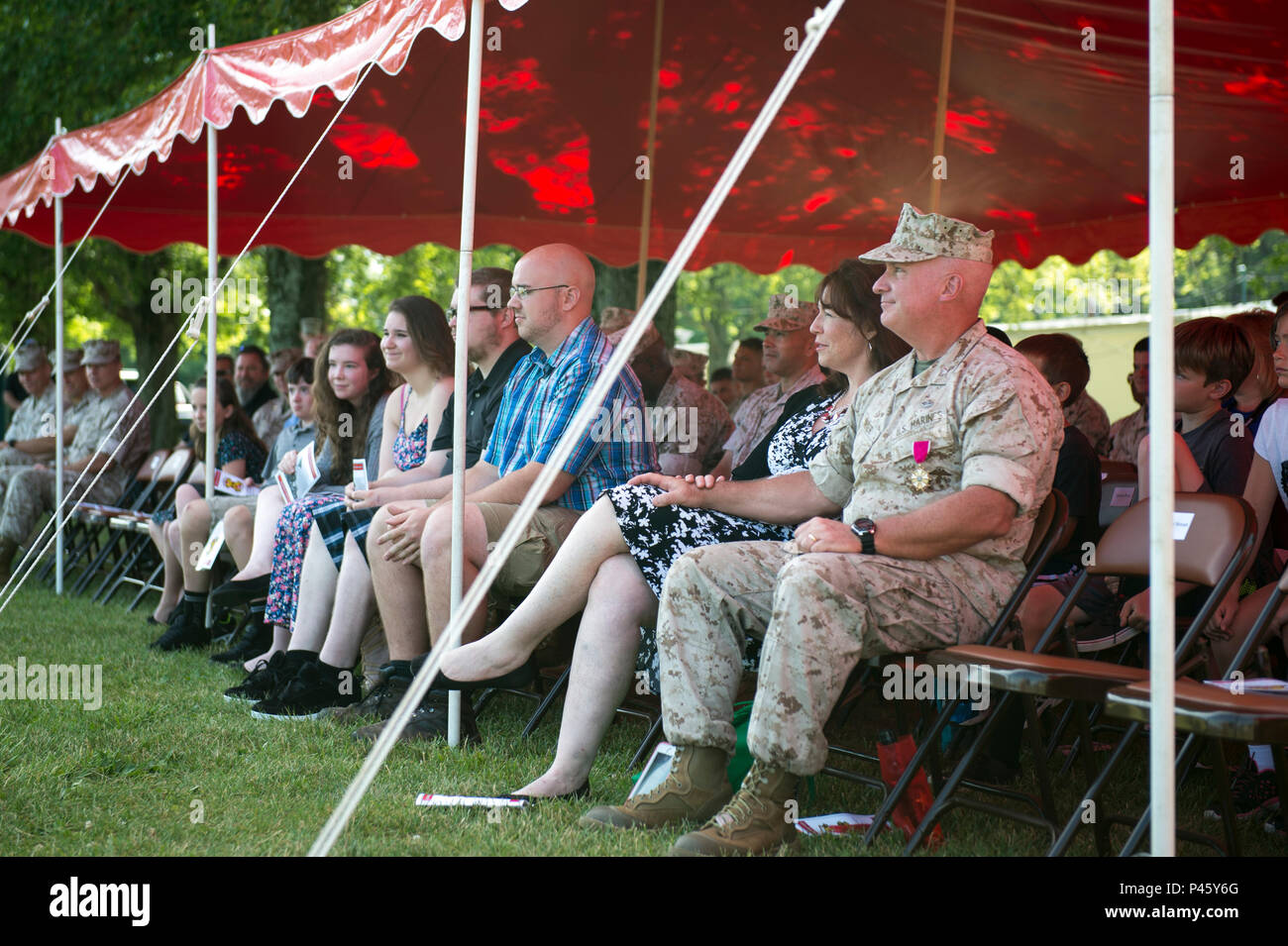 U.S. Marine Corps Col. Timothy Parker sits with his family at the ...