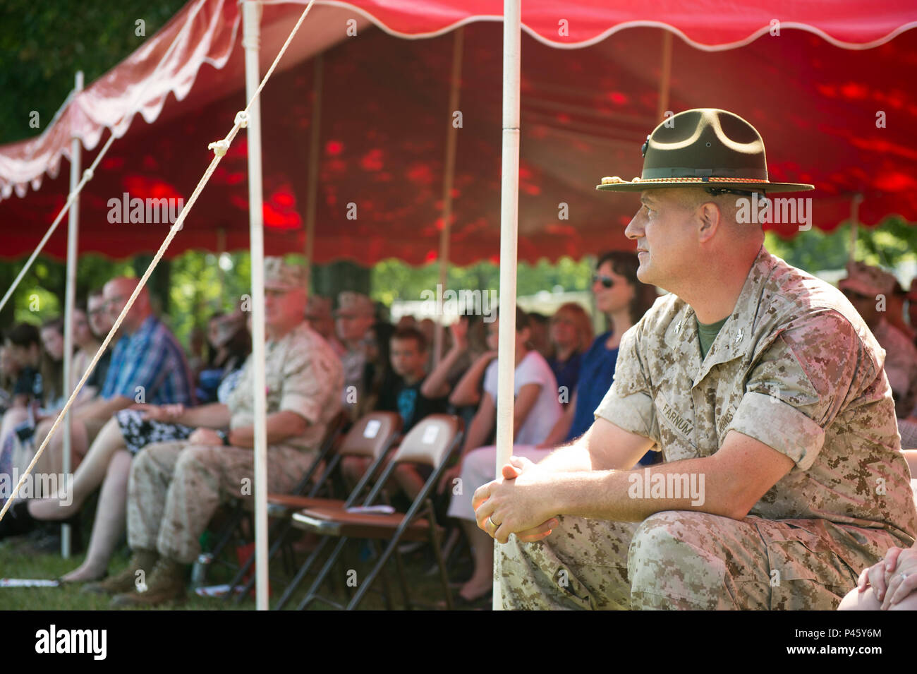 U.S. Marine Corps Col. Peter Farnum sits with his family at the Weapons ...