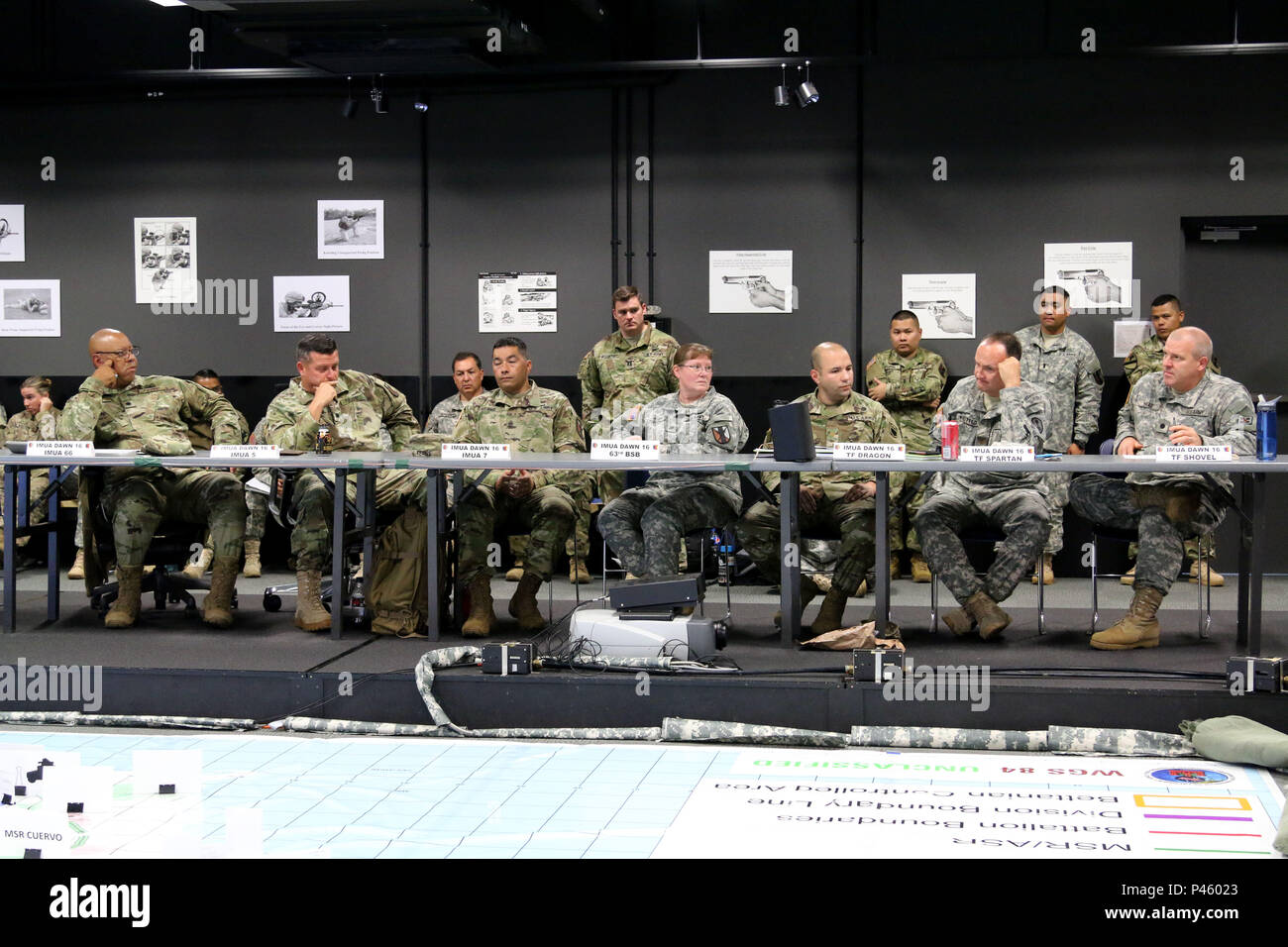 Commanding officers and noncommissioned officers of the host unit and supporting units of exercise Imua Dawn 2016 discuss their unit’s mission concepts and concerns during the Combined Arms Rehearsal brief at Imua Dawn 2016, Sagamihara Depot, Japan, June 15, 2016. Imua Dawn 2016 focuses on maneuver support operations and enhancing cooperative capabilities in mobility, Humanitarian Assistance and Disaster Relief (HADR), Noncombatant Evacuation Operations (NEO), and sustainment support in the event of natural disasters and other crises that threaten public safety and health in the Pacific region Stock Photo
