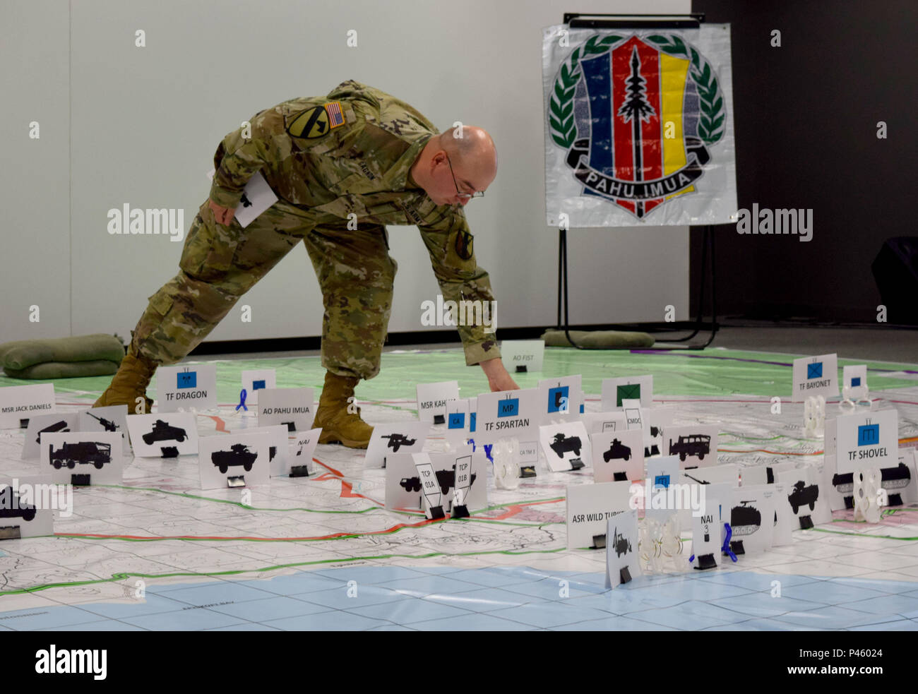 Sgt. 1st Class Michael Gagnon, senior supply sergeant, 63rd Brigade Support Battalion, participates in the Combined Arm Rehearsal brief at exercise Imua Dawn 2016, Sagamihara Depot, Japan, June 15, 2016. Imua Dawn16 focuses on maneuver support operations and enhancing cooperative capabilities in mobility, humanitarian assistance and disaster relief, noncombatant evacuation operations, and sustainment support in the event of natural disasters and other crises that threaten public safety and health. Stock Photo