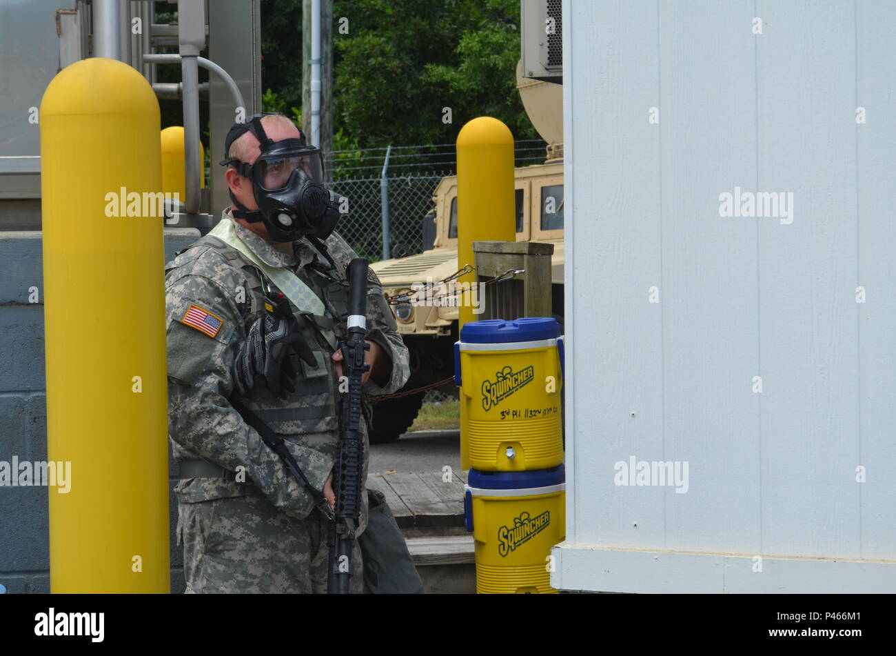 WILMINGTON, N.C. – Citizen-Soldiers assigned to NC National Guard's 1132nd Military Police Company react to a chemical bomb attack. They are supporting the Port of Wilmington’s police force during Operation Vigilant Seahawk from June 13 - 22, 2016. They will conduct site security operations across the entire port. “We are impressed with the Guard’s professionalism and expertise in checkpoint and vehicle searching techniques,” said Port of Wilmington Chief of Police, G.S. Teague. “They are a great partner and wish we could have them around longer than one week.” Stock Photo