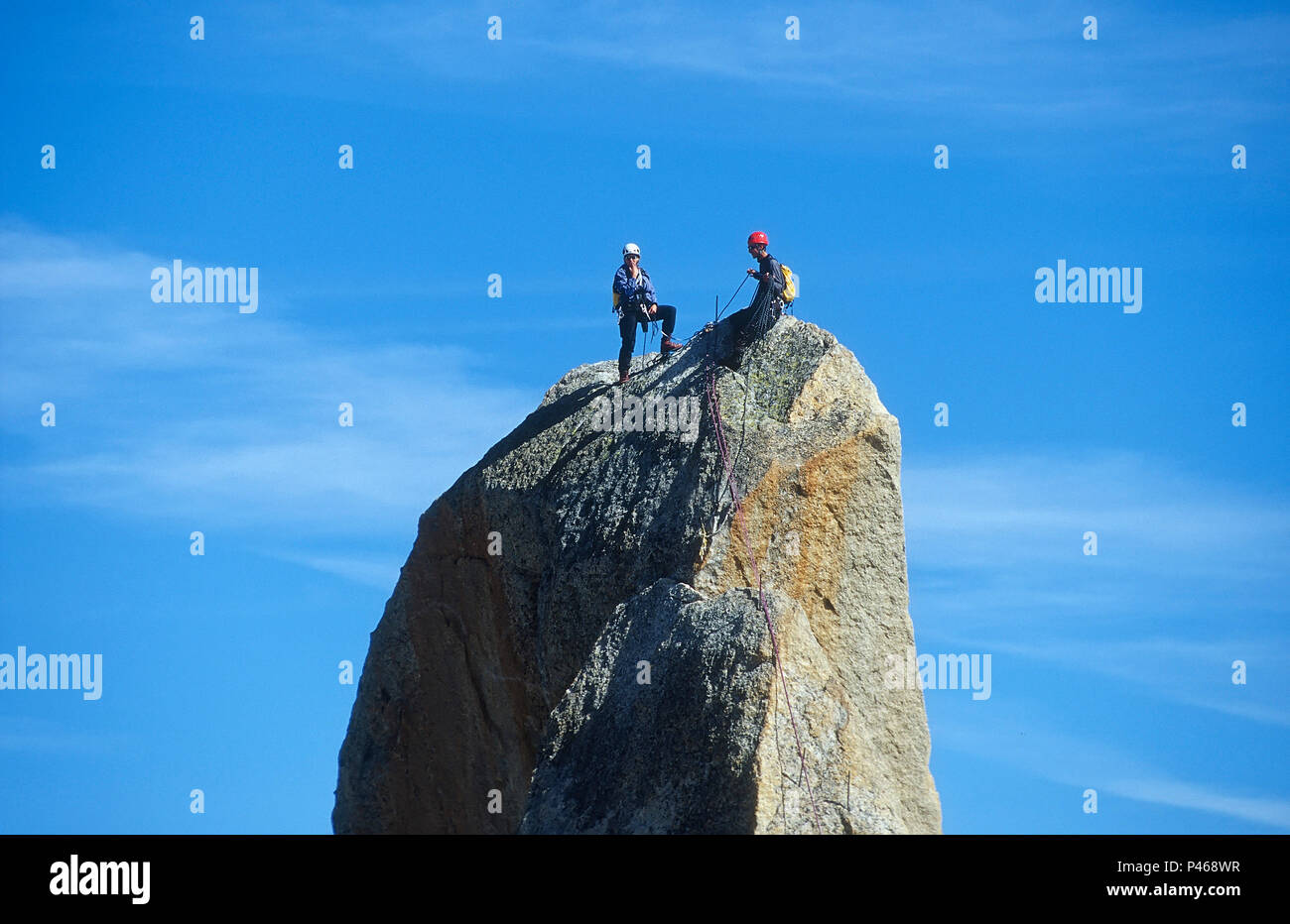 Rock climbers on the summit of the Point Rebuffat on the Aiguille du Midi in the French Alps, Chamonix, France Stock Photo
