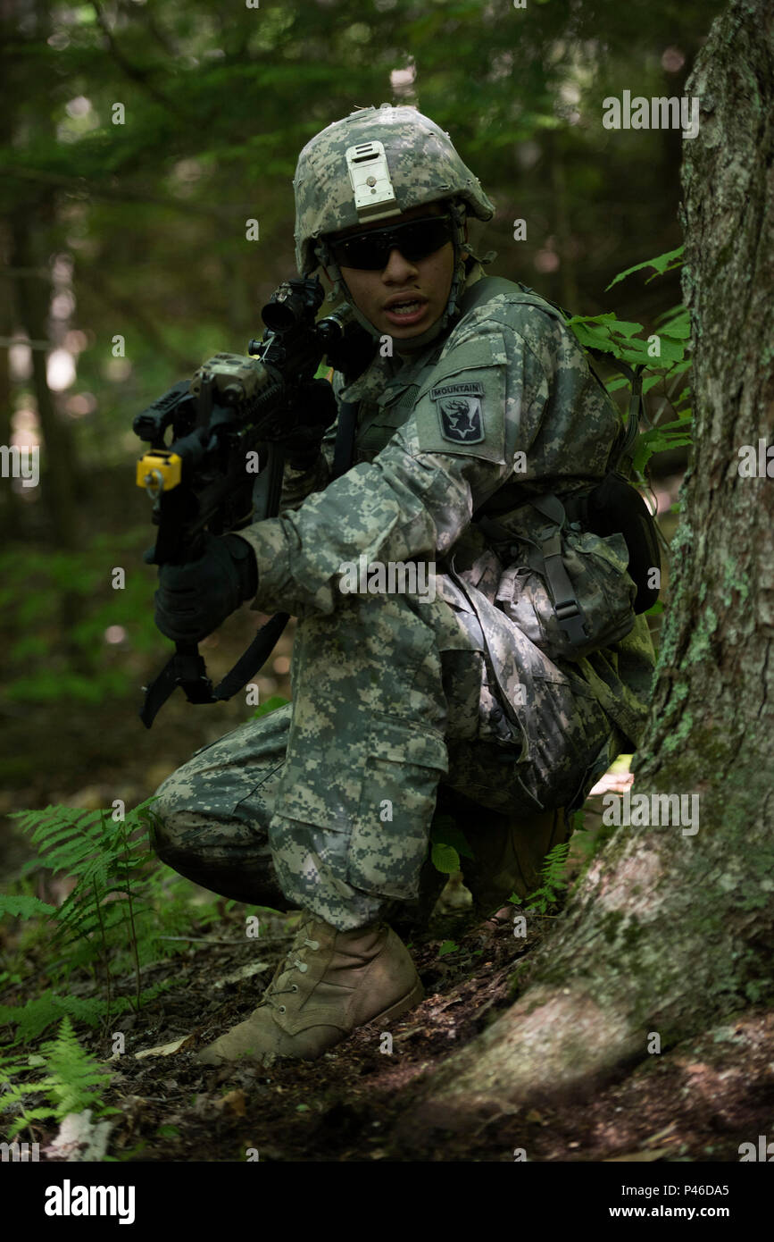 U.S. Army Pfc. Saul Hernandez, assigned to Alpha Company, 3rd Battalion, 172nd Infantry Regiment, 86th Infantry Brigade Combat Team (Mountain), Vermont National Guard, prepares to bound forward at Camp Ethan Allen Training Site, Jericho, Vt., June 15, 2016. Hernandez is running through an assault lane as part of a buddy-team exercise, during the unit’s two-week annual training. (U.S. Air National Guard photo by Tech. Sgt. Sarah Mattison/Released) Stock Photo