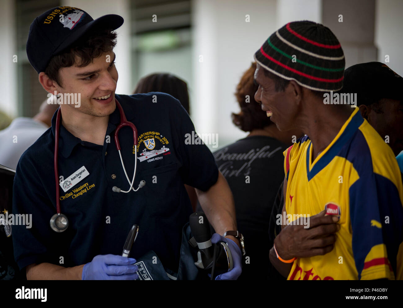 160613-N-QW941-266 DILI, Timor Leste (June 13, 2016) Aram Durgerian, a non-governmental organization volunteer and native of San Fransisco, attached to USNS Mercy (T-AH 19) talks with a Timorese man while at Gleno Community Health Center. Mercy is currently in Timor Leste supporting Pacific Partnership 2016. This year marks the sixth time the mission visited Timor Leste since its first visit in 2006. Medical, engineering and various other personnel embarked aboard Mercy are working side-by-side with partner nation counterparts, exchanging ideas, building best practices and relationships to ens Stock Photo
