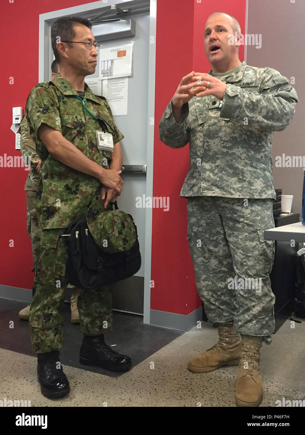 Maj. Gen. Mitsuhiko Horikiri (left), vice chief of staff (international), Japan Ground Self-Defense Force Central Readiness Force, meets Lt. Col. John C. Haas, Commander, 391st Engineer Battalion, during a visit to Sagamihara Depot Mission Training Complex during exercise Imua Dawn 2016, Sagamihara, Japan, June 18, 2016. Imua Dawn 2016 provides opportunities for U.S. and the Japan Ground Self-Defense Force to come together and train for potential real world events. Humanitarian Assistance and Disaster Relief (HADR) and Noncombatant Evacuation Operations (NEO) training activities enable our Ser Stock Photo